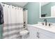 Cozy bathroom featuring neutral tones, a shower with curtain, and an elegant vanity at 413 Hallie Long Ln, Burlington, NC 27217