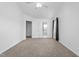 Bright, carpeted bedroom with a ceiling fan and two windows with natural light at 413 Hallie Long Ln, Burlington, NC 27217