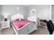Comfortable bedroom with carpet, a white bed, and storage for ultimate convenience at 413 Hallie Long Ln, Burlington, NC 27217