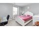 Bedroom with plush carpet, lots of natural light, and a comfortable bed for a restful retreat at 413 Hallie Long Ln, Burlington, NC 27217