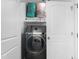 Laundry area featuring modern washing machine with shelving at 413 Hallie Long Ln, Burlington, NC 27217