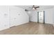 This modern living room offers wood-look flooring and ample natural light, a blank slate for personalization at 413 Hallie Long Ln, Burlington, NC 27217
