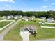Aerial view showcasing a well-planned community with beautiful homes, green spaces, and convenient street layouts at 50 N Nolan Park Dr, Selma, NC 27576