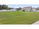 Spacious backyard ideal for outdoor activities, complemented by a well-maintained lawn and a cozy patio area at 50 N Nolan Park Dr, Selma, NC 27576