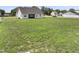 Expansive backyard offers ample space for recreation and landscaping possibilities in a peaceful neighborhood setting at 50 N Nolan Park Dr, Selma, NC 27576