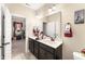 Bathroom with double sinks, white marble countertops, and a stylish decorative theme at 50 N Nolan Park Dr, Selma, NC 27576