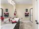 Well-lit bathroom featuring a marble countertop, dark cabinets, and a glass-enclosed shower at 50 N Nolan Park Dr, Selma, NC 27576