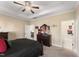 Bedroom boasts a trey ceiling with fan and a view to an additional interior room at 50 N Nolan Park Dr, Selma, NC 27576