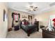 Charming bedroom features decorative wall art, decorative curtains, and dark furniture at 50 N Nolan Park Dr, Selma, NC 27576