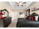 Spacious bedroom features a bed, dresser, and trey ceiling with fan at 50 N Nolan Park Dr, Selma, NC 27576