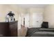Bedroom view showcasing a chest of drawers, interior doorways, neutral walls, and carpeted floors at 50 N Nolan Park Dr, Selma, NC 27576