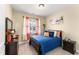 Comfortable bedroom with a bed, side tables, window, and closet at 50 N Nolan Park Dr, Selma, NC 27576