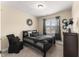 Bedroom featuring neutral walls, carpeted floors, a window, and a bed with black bedding at 50 N Nolan Park Dr, Selma, NC 27576