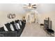 Overhead angle of bonus room with carpeting, a sofa and easy access to a powder room at 50 N Nolan Park Dr, Selma, NC 27576