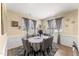 Dining room complete with a gray rug, wainscoting, curtains, a mirror and an oval table at 50 N Nolan Park Dr, Selma, NC 27576