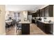 Modern kitchen features granite counters, stainless appliances, and a breakfast bar island with seating at 50 N Nolan Park Dr, Selma, NC 27576