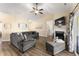 Inviting living area with comfortable seating, a fireplace, and a view of the backyard at 50 N Nolan Park Dr, Selma, NC 27576