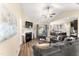 Cozy living room with a fireplace, vaulted ceilings, and plenty of natural light at 50 N Nolan Park Dr, Selma, NC 27576