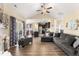 Open-concept living room with vaulted ceilings and seamless flow into kitchen and dining area at 50 N Nolan Park Dr, Selma, NC 27576