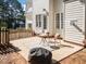 Back of house showing patio with room for seating, plus fenced yard and partial view of house at 513 Moultonboro Ave, Wake Forest, NC 27587