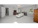 Bright bedroom with a sofa, carpet, and natural light from several windows at 513 Moultonboro Ave, Wake Forest, NC 27587