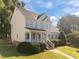 Two-story home with inviting front porch and lush lawn, a perfect blend of comfort and curb appeal at 513 Moultonboro Ave, Wake Forest, NC 27587