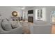 Bright living room featuring a fireplace, neutral furniture, and large windows with natural light at 513 Moultonboro Ave, Wake Forest, NC 27587