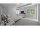 Spacious main bedroom with tray ceilings, carpet, a dresser with TV, and plenty of natural light at 513 Moultonboro Ave, Wake Forest, NC 27587