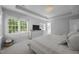 Bright main bedroom with carpet, a TV, a dresser, and a tray ceiling at 513 Moultonboro Ave, Wake Forest, NC 27587