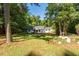 Inviting single-story home with a well-manicured front yard, mature trees, and charming curb appeal at 514 Lipscomb Grove Church Rd, Hillsborough, NC 27278