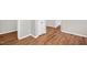 Hallway with lovely wood flooring and white trim at 514 Lipscomb Grove Church Rd, Hillsborough, NC 27278