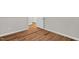 Open hallway featuring wood-look floors, fresh neutral paint, and views to other rooms at 514 Lipscomb Grove Church Rd, Hillsborough, NC 27278