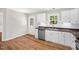 Charming kitchen features stainless appliances and white cabinets at 514 Lipscomb Grove Church Rd, Hillsborough, NC 27278