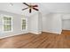 Inviting living room features wood-look flooring, ample natural light, and versatile open space at 514 Lipscomb Grove Church Rd, Hillsborough, NC 27278