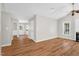 Bright living room features modern flooring, neutral paint, an open layout, and access to the kitchen at 514 Lipscomb Grove Church Rd, Hillsborough, NC 27278