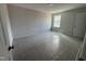 Bright bedroom featuring neutral walls, carpet, and a window providing natural light at 5428 Jaeger Dr # 45, Graham, NC 27253