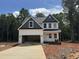Newly constructed two-story home featuring white siding and a convenient attached garage at 5428 Jaeger Dr # 45, Graham, NC 27253