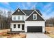 Charming two-story home with white siding, black trim, and a well-manicured lawn at 5428 Jaeger Dr # 45, Graham, NC 27253