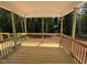 Wood floored screened porch overlooking a private wooded area, perfect for relaxation at 5428 Jaeger Dr # 45, Graham, NC 27253
