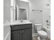 Bathroom featuring gray vanity with brushed gold hardware and a tub/shower combination at 555 Forestville Rd, Wake Forest, NC 27587
