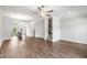 Spacious living room with hardwood floors and open layout to dining and kitchen at 555 Forestville Rd, Wake Forest, NC 27587