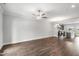 Expansive open concept floor plan with hardwood floors, gray walls and modern ceiling fan at 555 Forestville Rd, Wake Forest, NC 27587