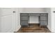 Stylish office nook with built-in desk, drawers, and hardwood flooring at 555 Forestville Rd, Wake Forest, NC 27587