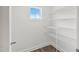 Walk-in pantry with metal shelving and a window for natural light at 555 Forestville Rd, Wake Forest, NC 27587