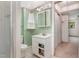 Small bathroom with a sink, toilet and shower stall in need of updating at 612 Locust Ln, Raleigh, NC 27603