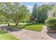 Spacious front lawn and mature trees line this residential street, creating a picturesque neighborhood setting at 612 Locust Ln, Raleigh, NC 27603