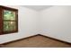 Bedroom with hardwood floors, a window with a view, and neutral walls at 616 Cross Timbers Dr, Durham, NC 27713