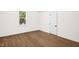 Bedroom featuring a window, neutral walls, and wood look flooring at 616 Cross Timbers Dr, Durham, NC 27713