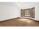Bright bedroom with hardwood floors, natural lighting, and bay windows at 616 Cross Timbers Dr, Durham, NC 27713