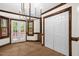 Elegant dining area with hardwood floors, built-in cabinetry, and French doors leading to an outdoor area at 616 Cross Timbers Dr, Durham, NC 27713